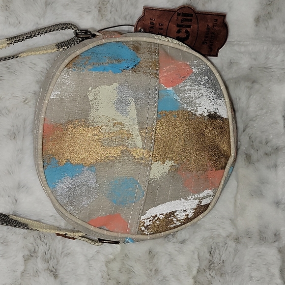 Canvas round crossbody purse. Has splashes of color. - Picture 2 of 10